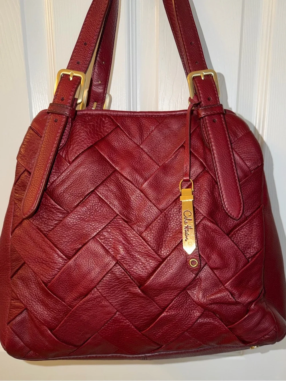 Cole Haan Burgundy Prudence Tote Bag featuring braided leather design